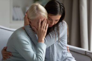 Mother crying on the death of her husband.