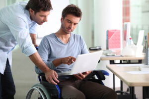 Disabled patient talking to his doctor for SSD consultation in Colorado Springs, CO.