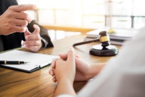 Injured woman talking to a Denver dog bite attorney about her case.