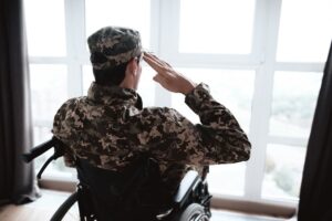 A Veteran in a Wheel Chair Saluting