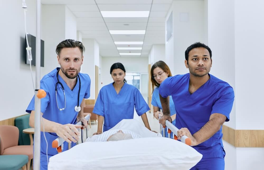 Medical team of doctors rushing to emergency room to treat patient.