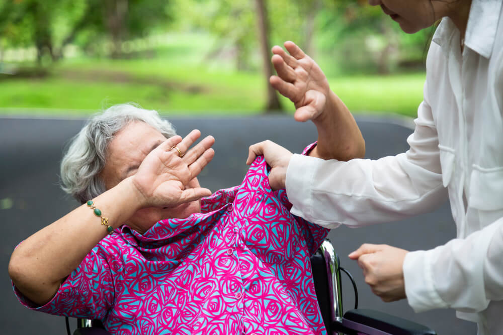 Senior lady abused in nursing home care.