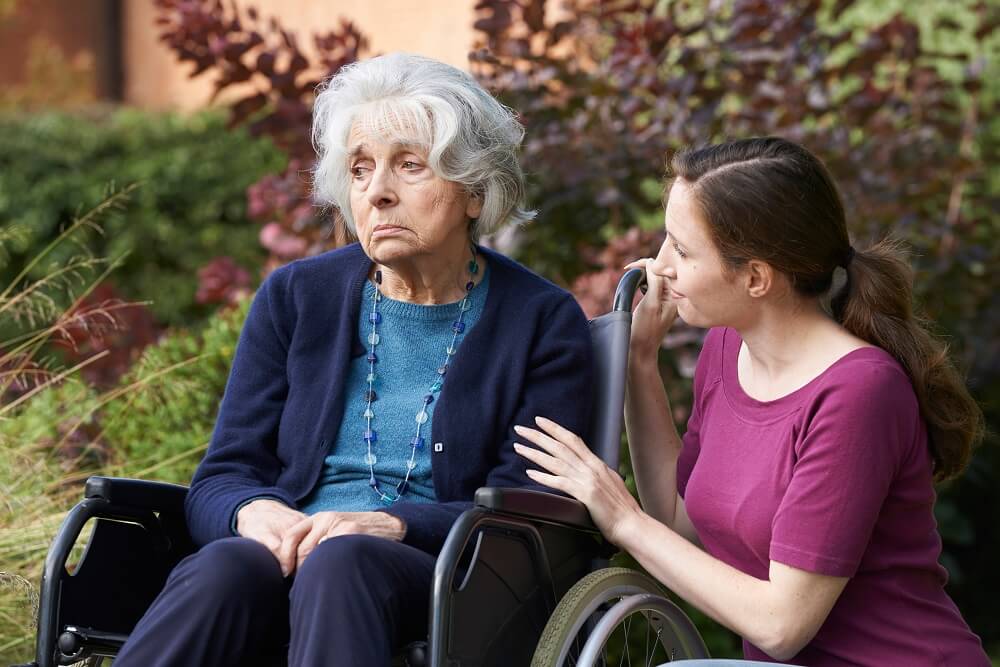 Old senior lady feeling sad in the nursing home care.