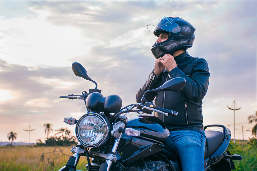 Biker wearing helmet for safety